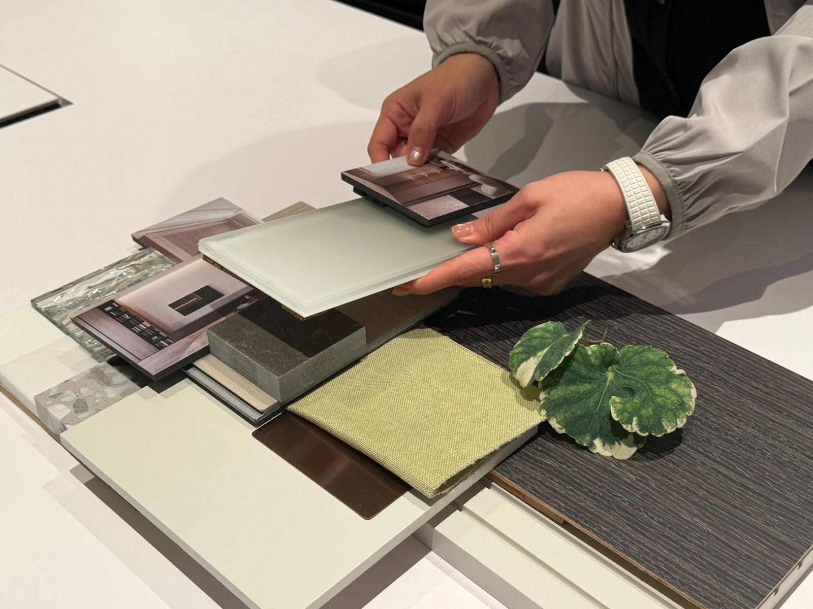A range of finish and material samples laid out at the Artwill studio for choosing an interior design style