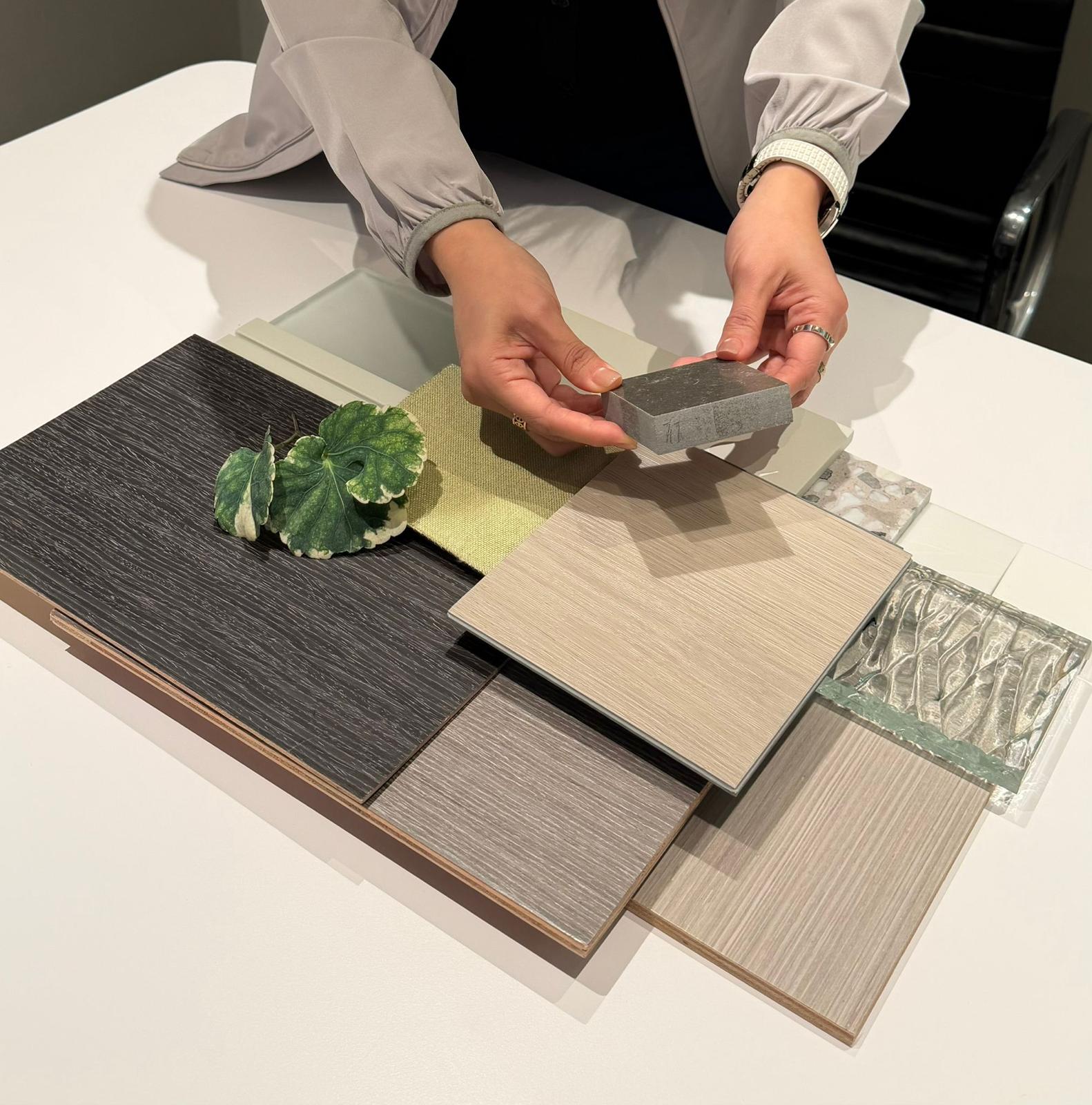 Warm off-white finish and fabric samples arranged for a cream style interior at the Artwill studio