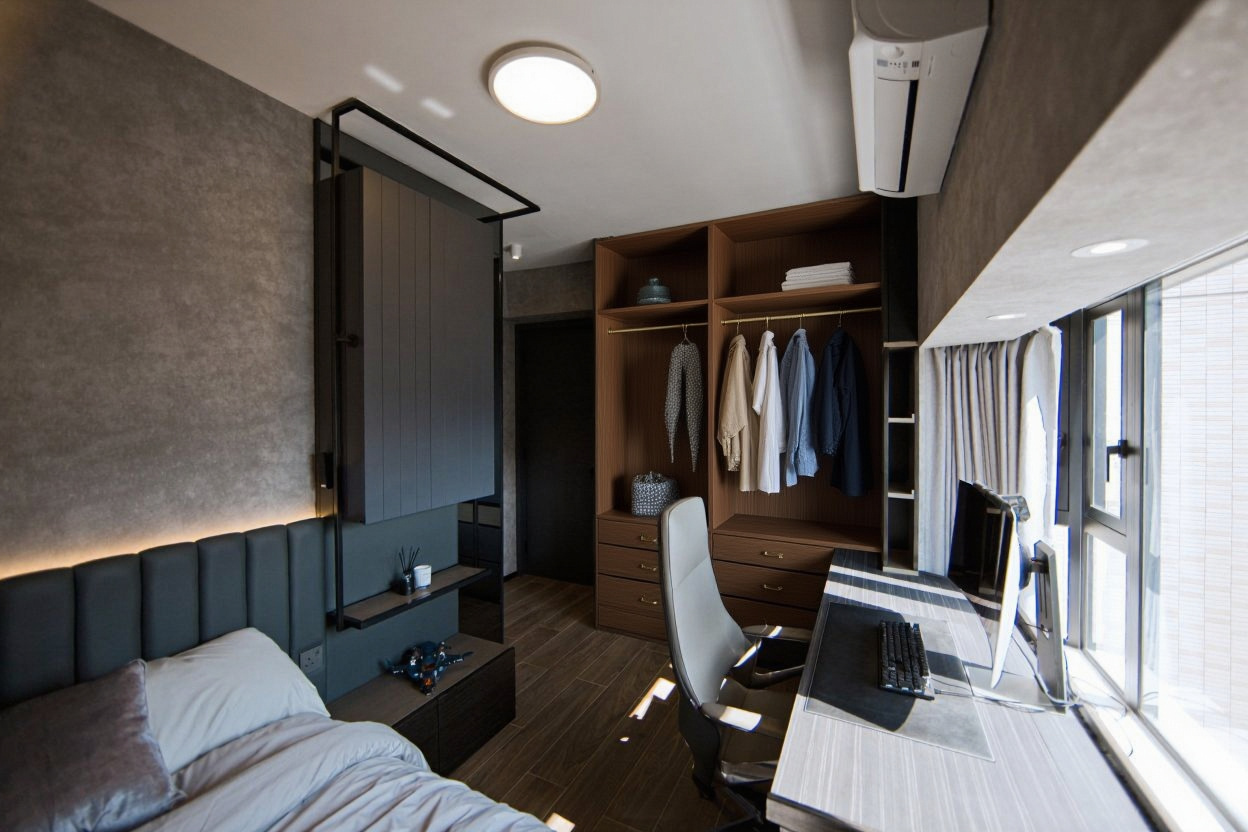 Open custom wardrobe interior with organised hanging rail, shelving and soft-close drawers in warm walnut wood with brass hardware