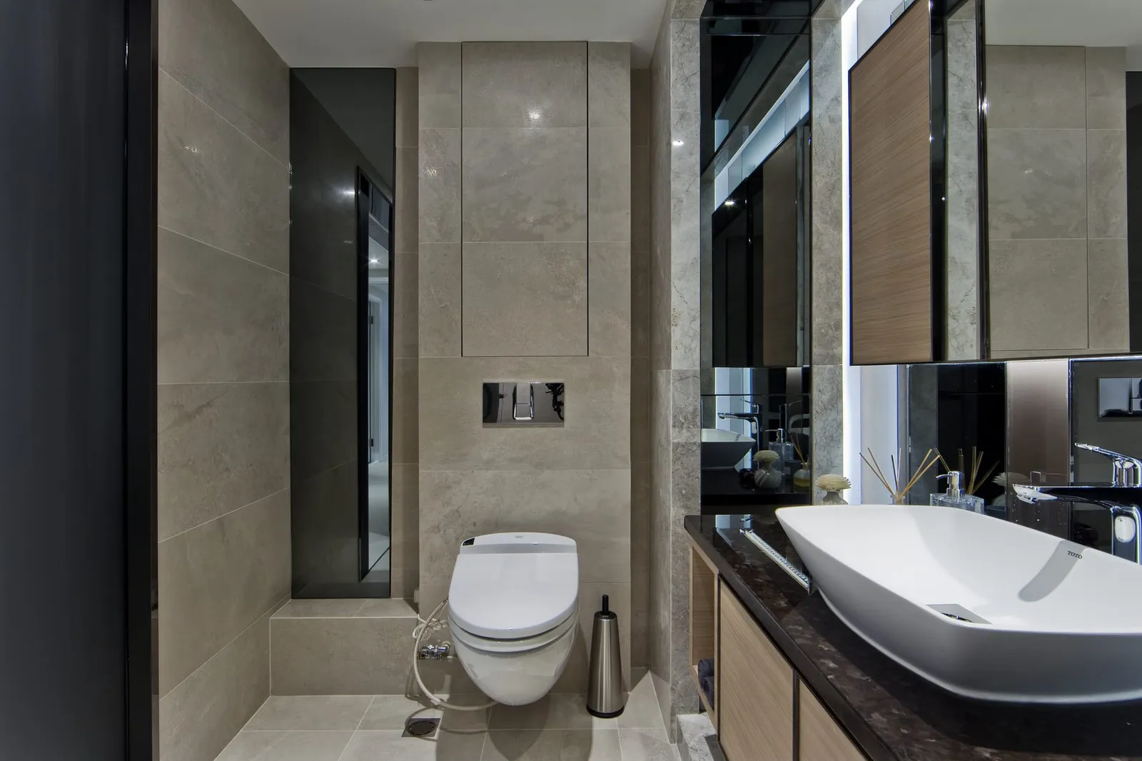Calm, well-finished interior surfaces and tiling reflecting Artwill's approach to bathroom design in Hong Kong