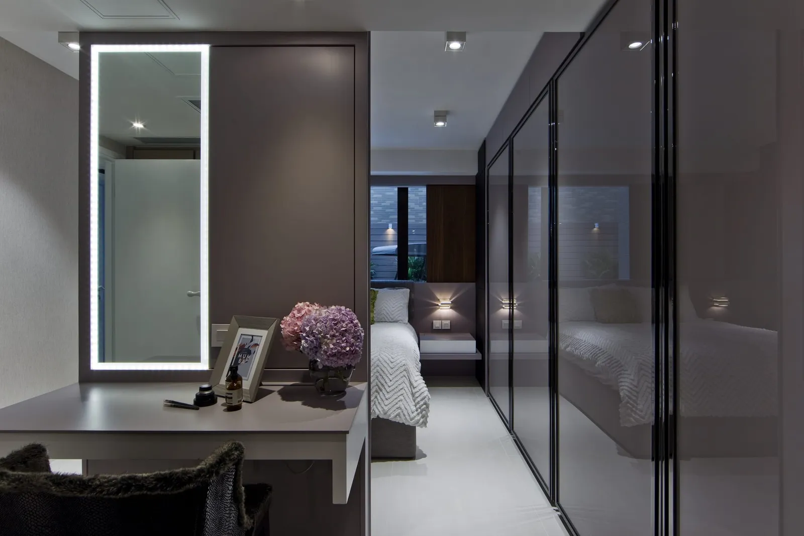 A glass sliding door dividing two rooms in a Hong Kong flat